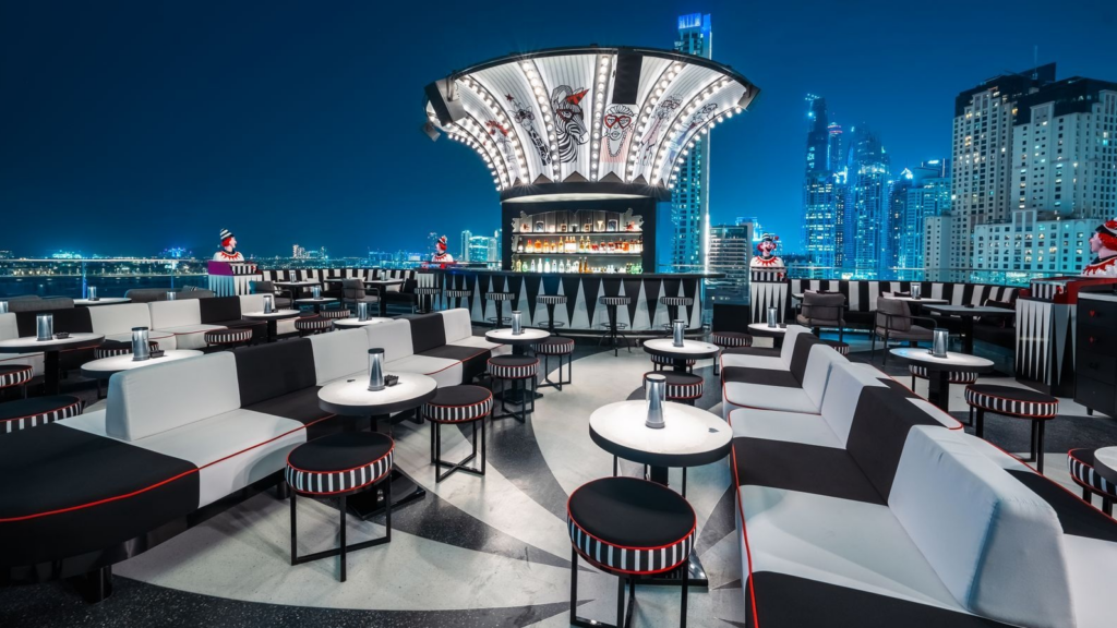 Luxury rooftop restaurant in Dubai decorated for Eid celebrations with skyline views, elegant dining setup, lantern lighting, and festive atmosphere