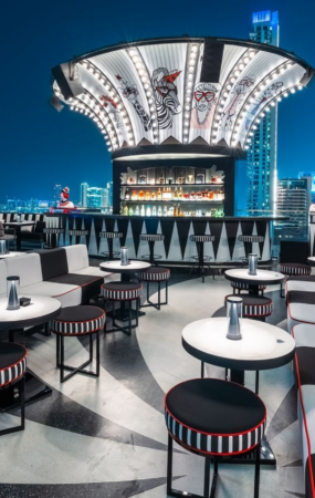Luxury rooftop restaurant in Dubai decorated for Eid celebrations with skyline views, elegant dining setup, lantern lighting, and festive atmosphere