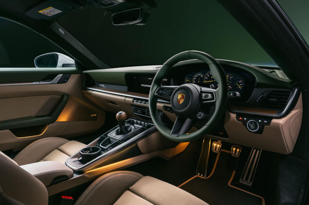 The Porsche 911 GT3 Earls Court 51 Edition parked outside a historic British landmark