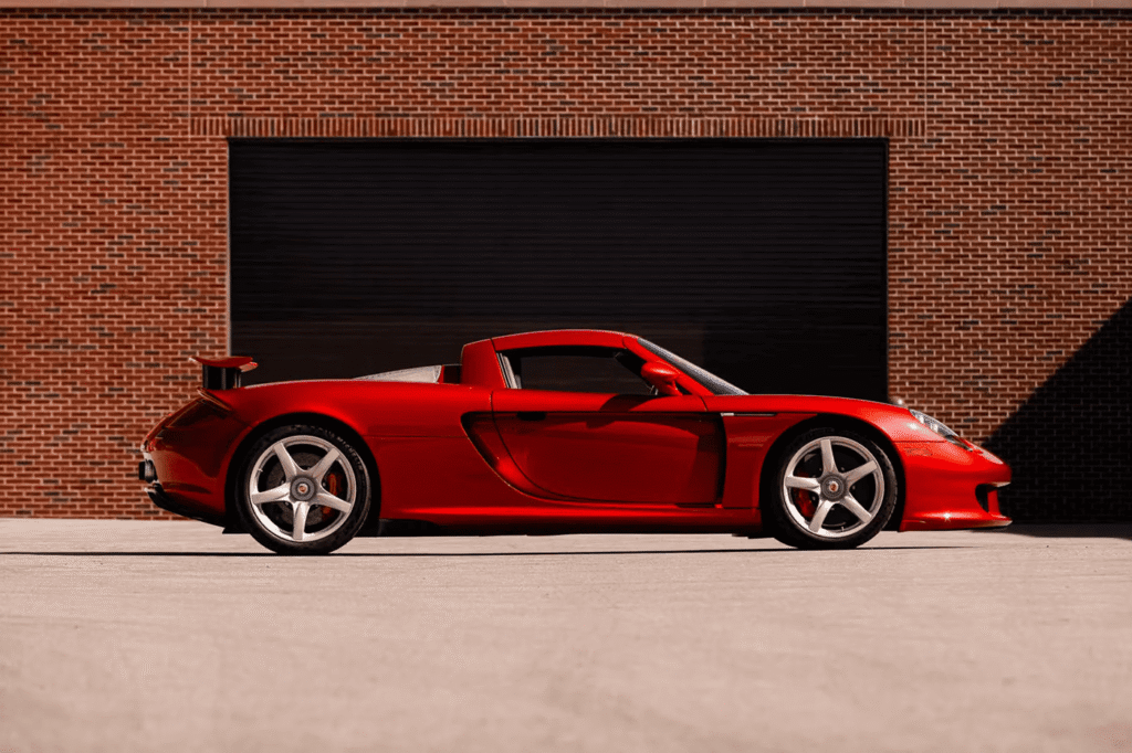 Rare Porsche Carrera GT finished in Ferrari Rosso Fuoco red at auction