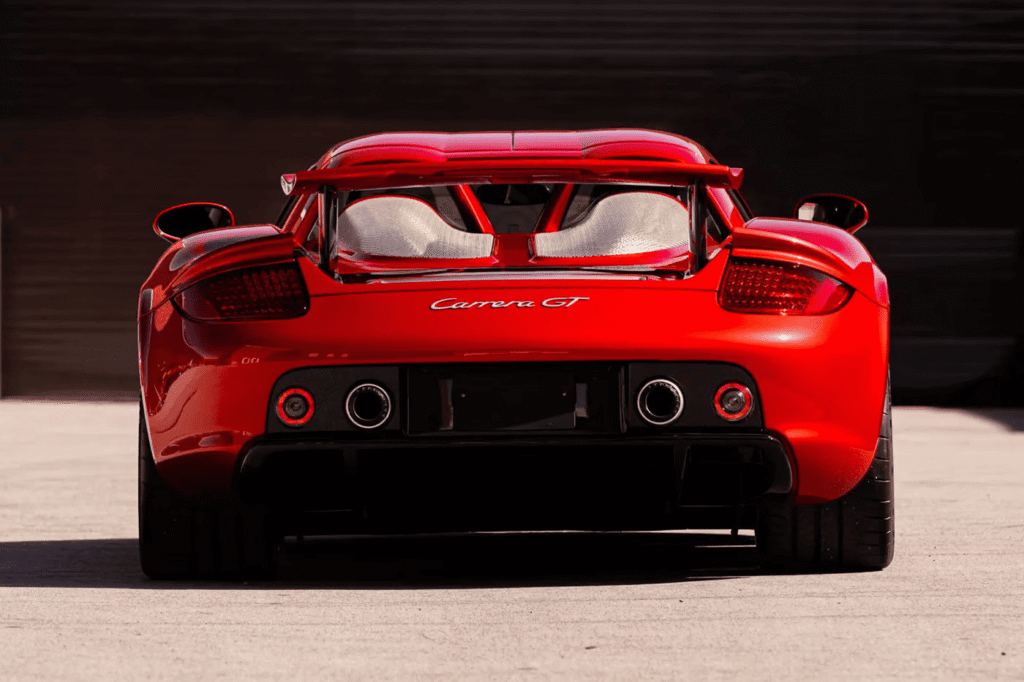 Rare Porsche Carrera GT finished in Ferrari Rosso Fuoco red at auction